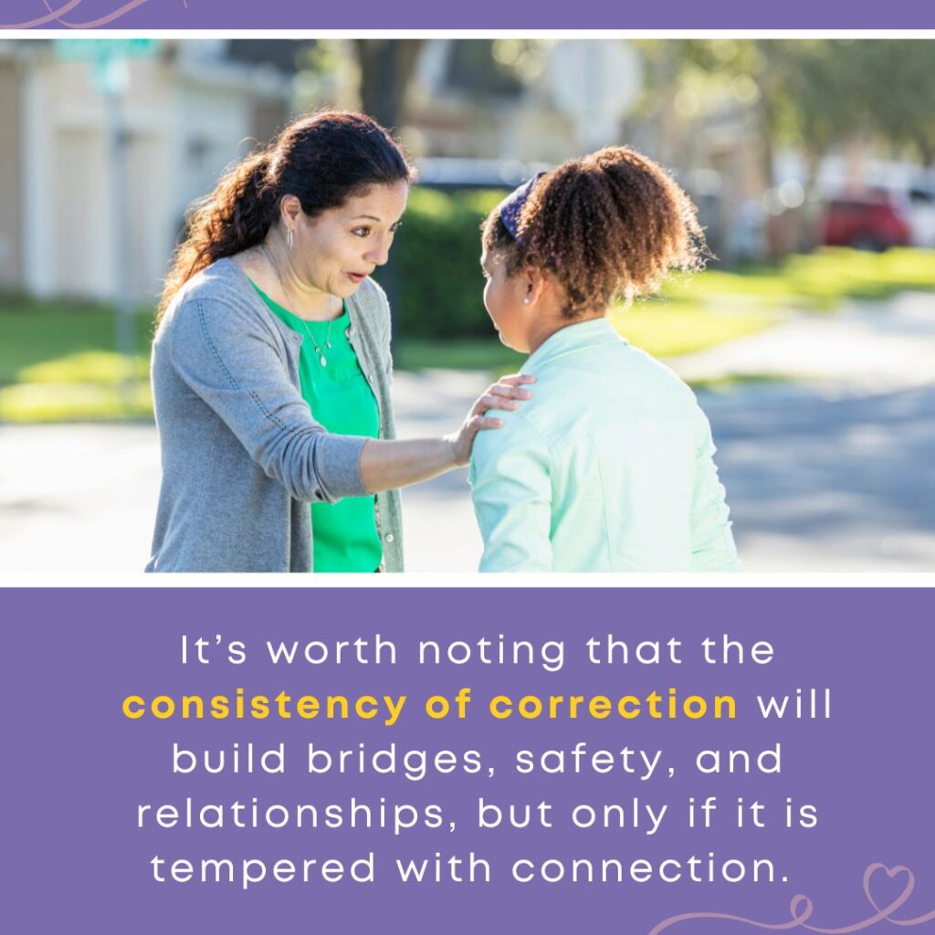A mother speaks gently to her daughter outdoors, hand on her shoulder, creating connection while offering correction.