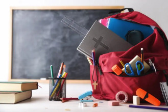 School backpack with Bible sticking out the top