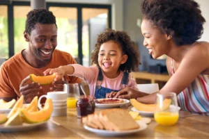 loving parents having breakfast with their child