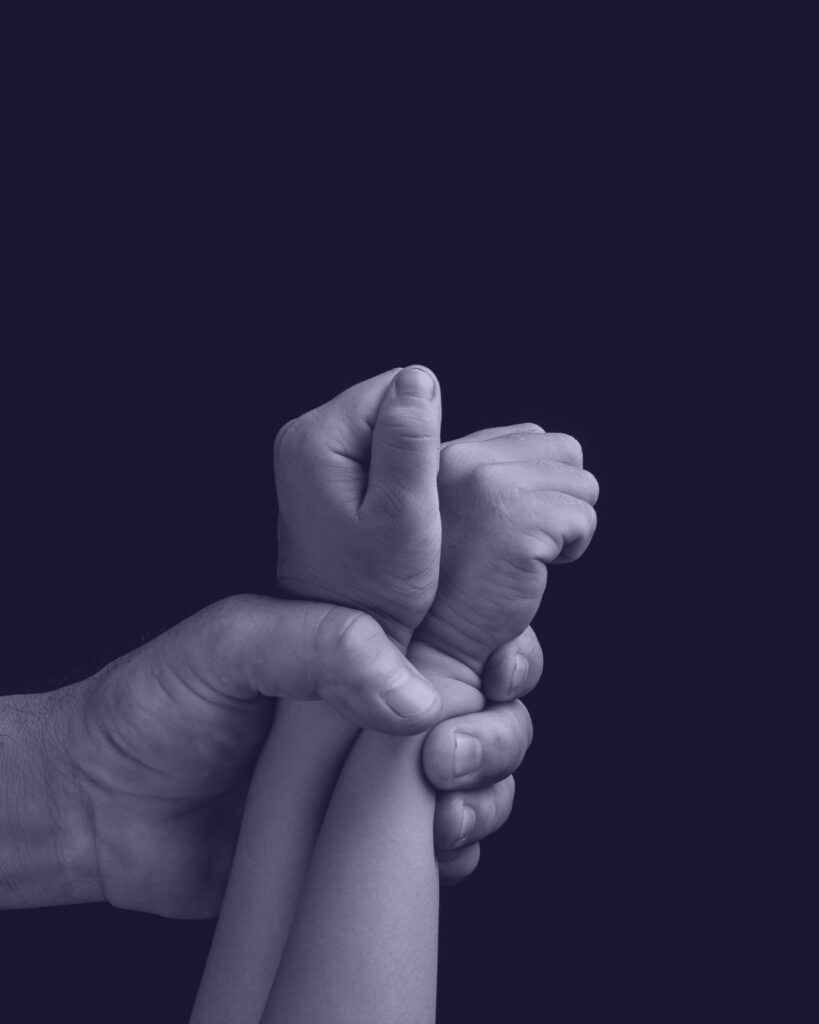 "Child Trafficking: Selling Children Through Abortion and Big Fertility" image of an adult hand cuffing together a child's hands with purple background.