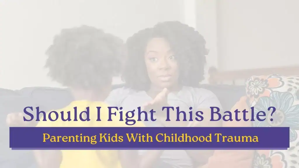 Mother talking seriously with her young child on a couch with text illustrating the challenges of parenting a kid with childhood trauma.