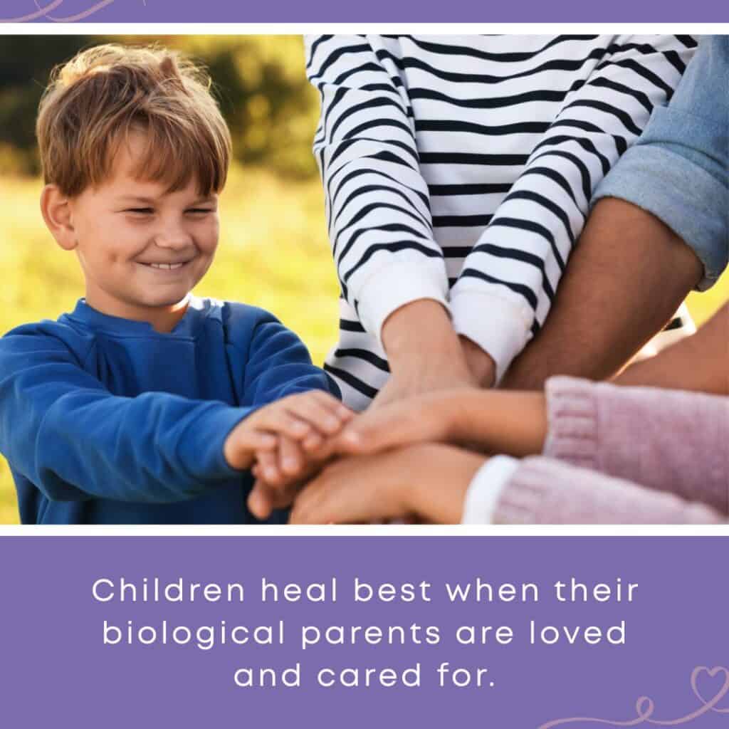 A smiling young boy joining hands with adults in a gesture of unity outdoors, with the quote: "Children heal best when their biological parents are loved and cared for." — a foster care reminder that supporting biological family is central to a child's healing journey.