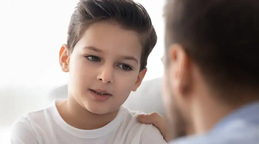 Father having heart-to-heart talk with his young son