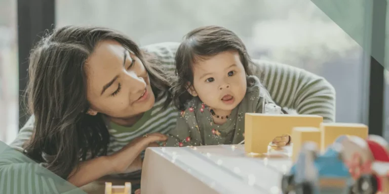 mother playing with autistic toddler