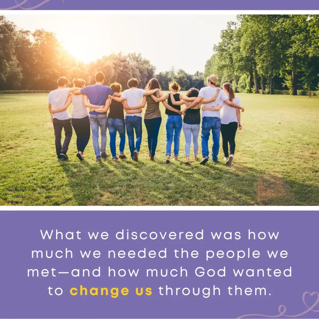A group walks together arm in arm across a sunlit field, representing the connection found within the foster care community.