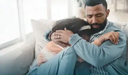 father-comforting-grieving-young-daughter